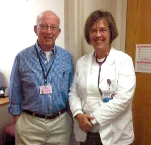 Norm Emery and a staff person at the Anne Silverman Free Clinic at Doylestown Hospital